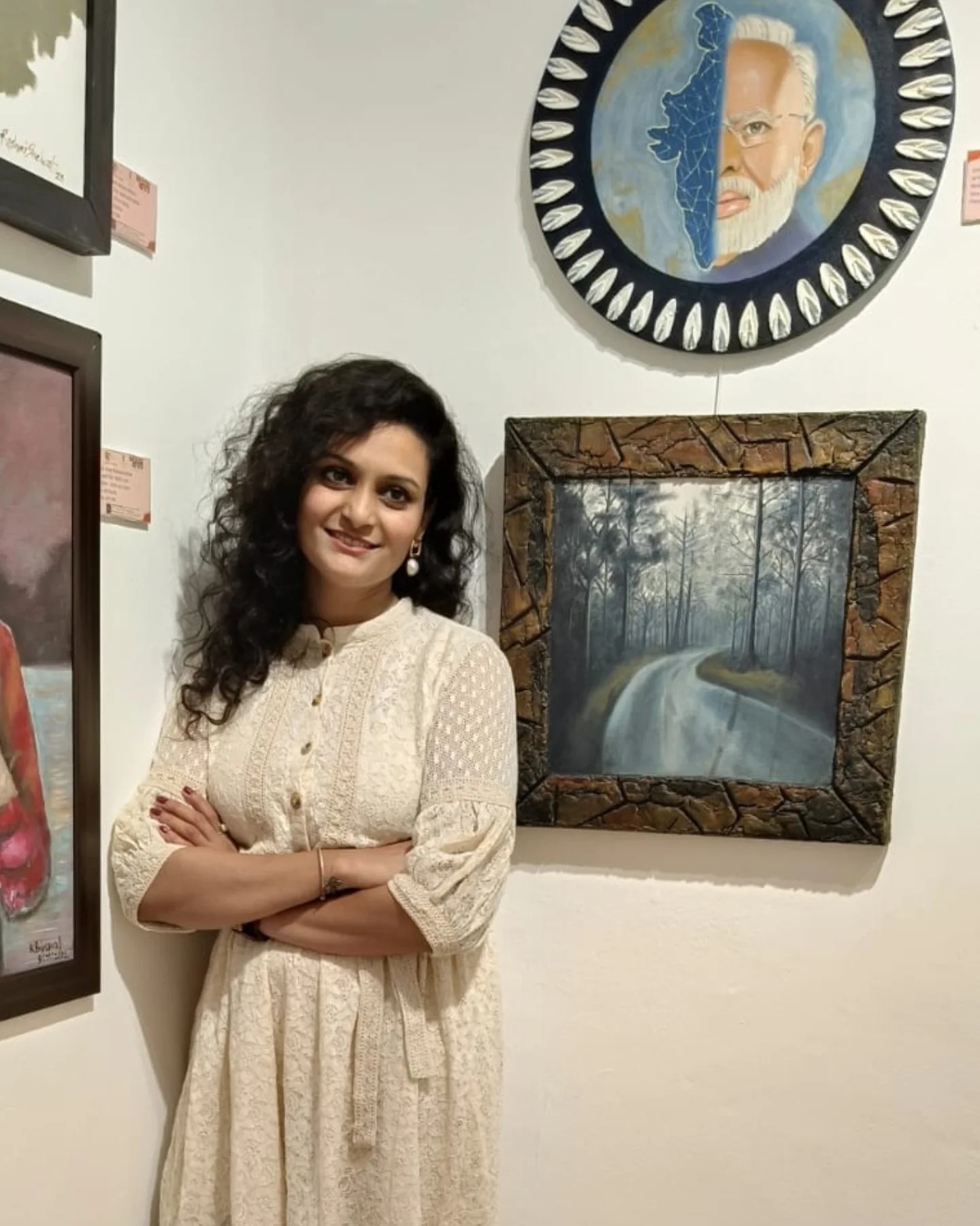 Artist beside exhibited works at the 2024 G20 Dubai art exhibition